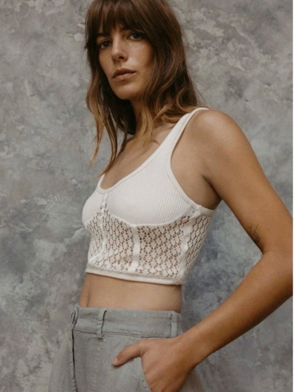 Zara bustier-style crop top features a ribbed scoop neckline and a delicate, she